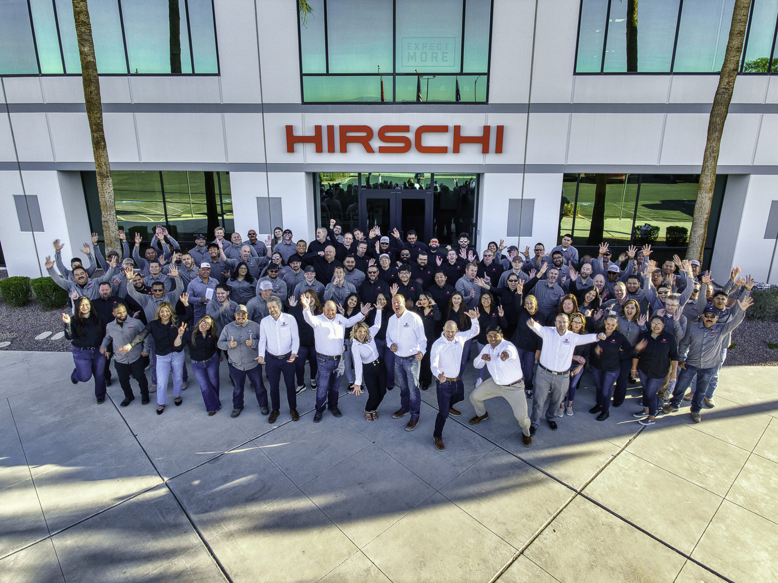 Hirschi Masonry stands together happily outside their office building in Las Vegas.