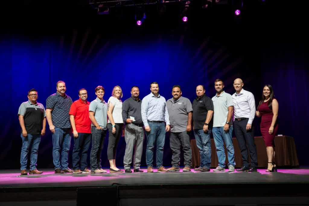 Hirschi Masonry stands together at an awards ceremony in Las Vegas as they receive the NCA Contractor of the Year award.